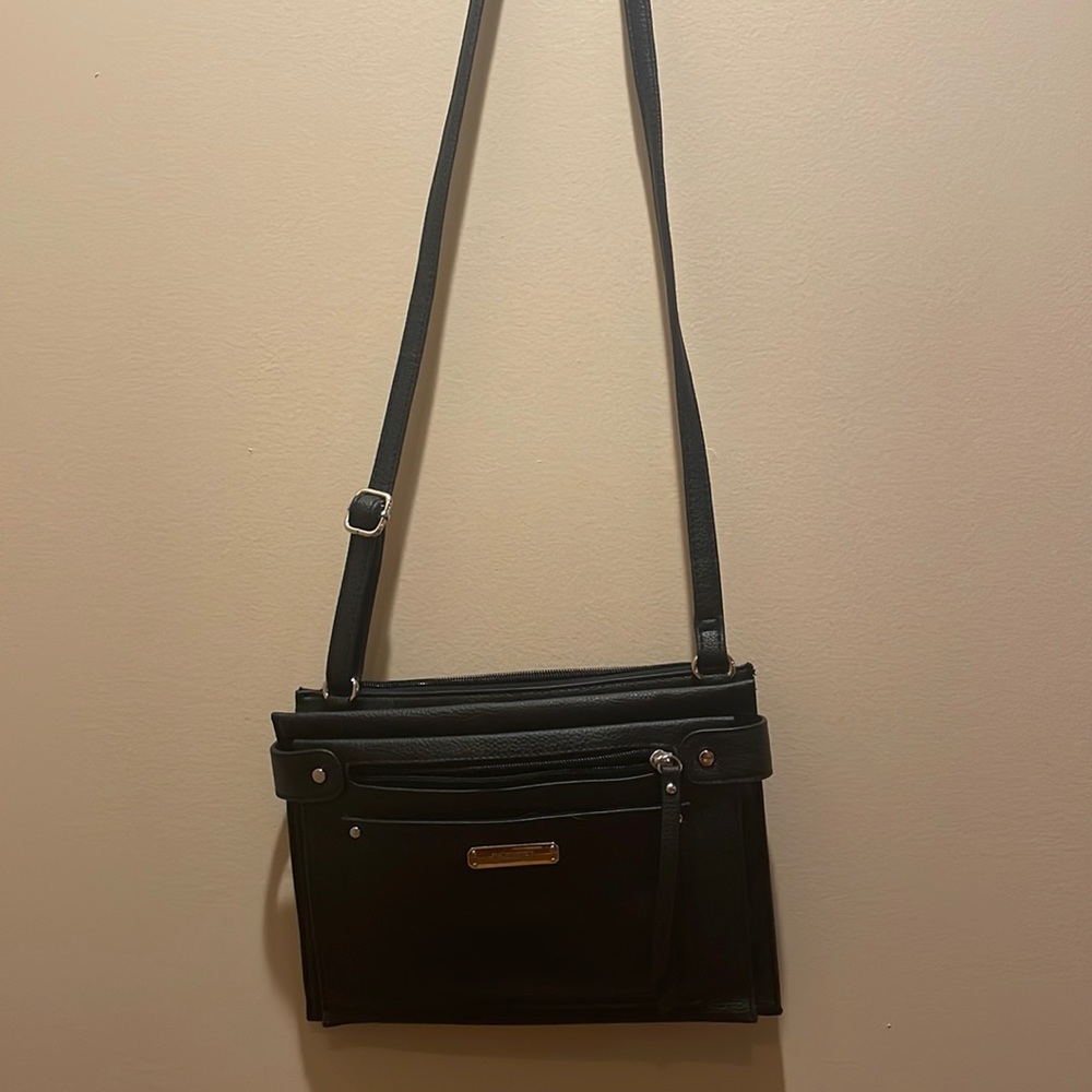 Rosetti black crossbody purse with zipper and open sections